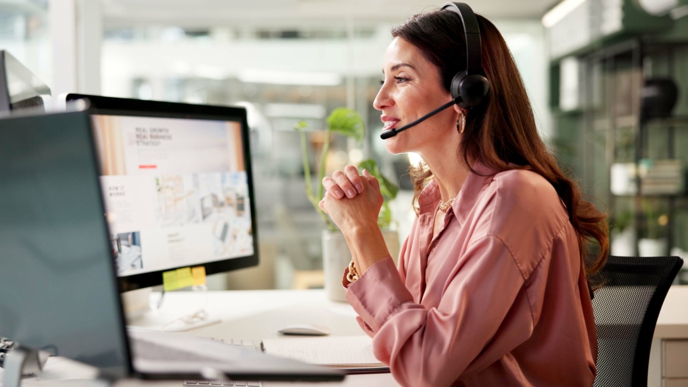 Woman, mic and computer screen at call center in office for crm, customer service and sales informa.